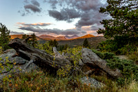 Sun-Kissed Peaks: Twin Sisters, Meeker, Longs Peak, and Kruger Rock.