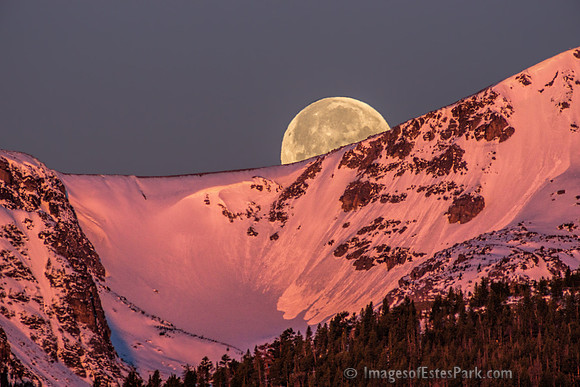 Moonset at Sunrise - Peaks on the Western Horizon Bathed in Alpenglow as Full Moon Sets