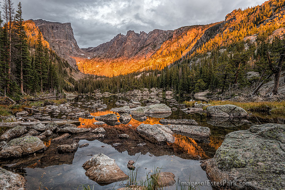 Fleeting moment of sunrise alpenglow on Hallett Peak & Flattop Mountain, reflected on Dream Lake 3/3
