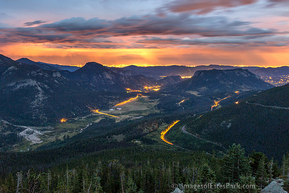 Streaming head/tail lights in RMNP with lights of Estes Park just left of Deer Mountain (right)